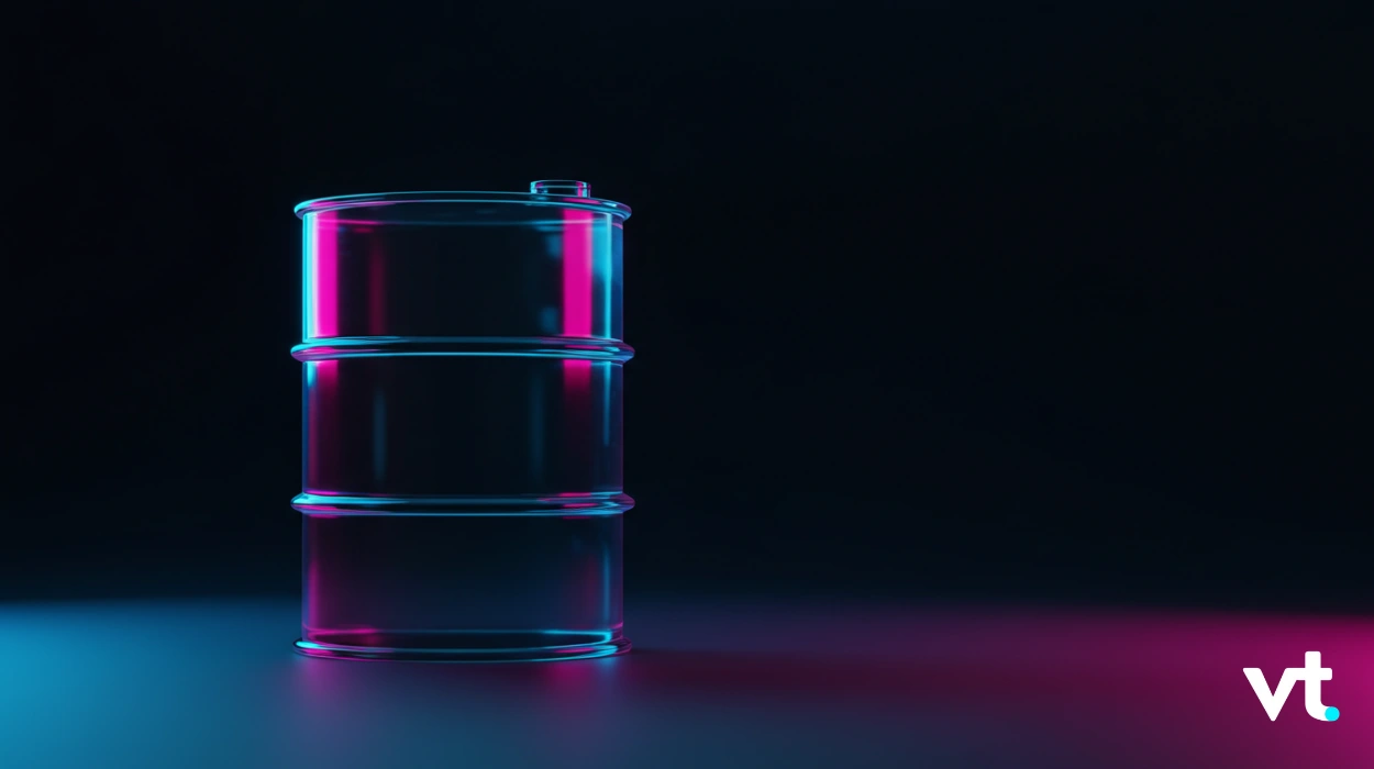 Three metal oil drums stacked on a dark surface, illuminated by blue and magenta neon lights with a VT logo in the bottom-right corner.